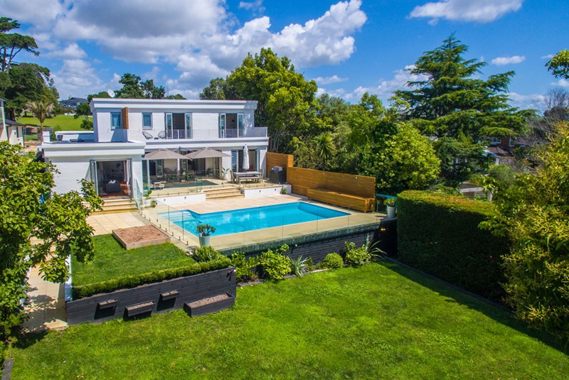 A beautiful 1950s brick home sitting high on Kohimarama Road.